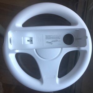 FIVE! Wheels for the WII systems. One is new in bag!